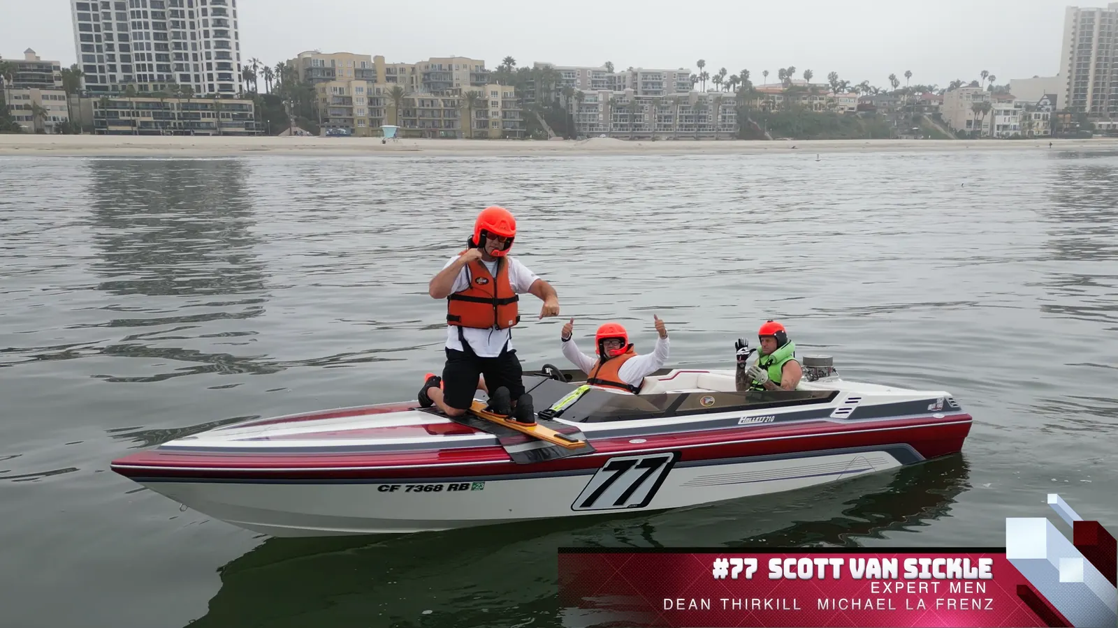 Number 77 race team gathered in their boat